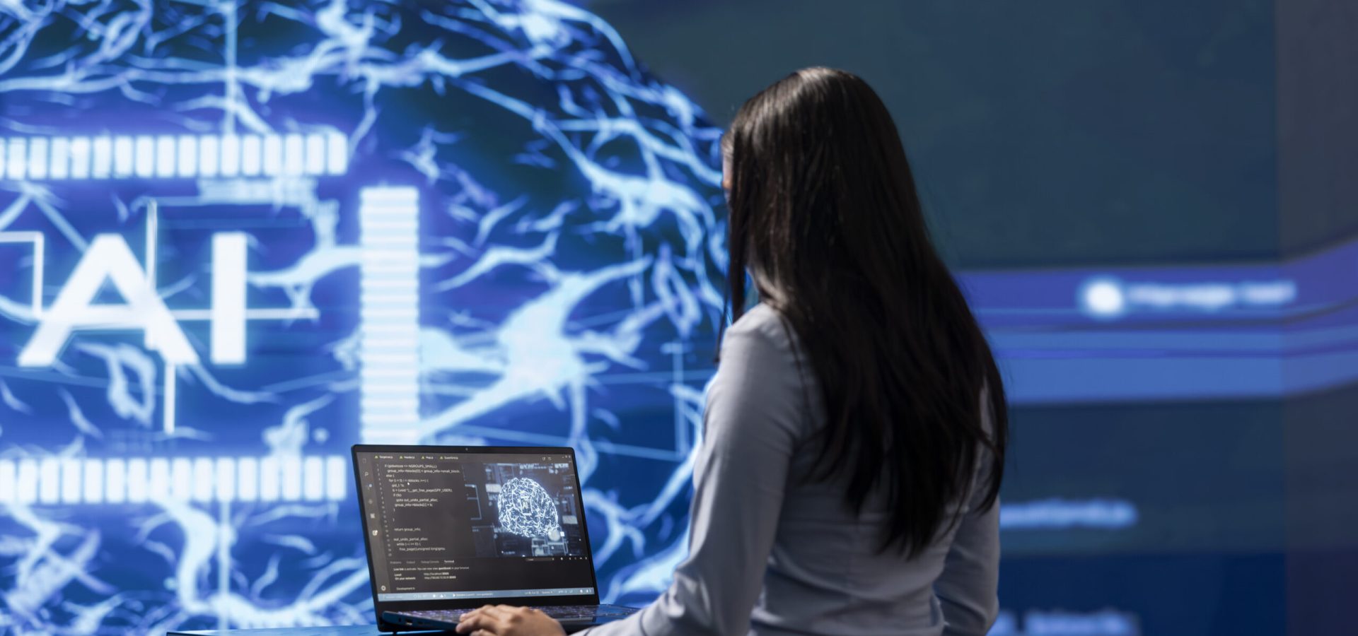 Admin using laptop to maintenance artificial intelligence neural networks made up of interconnected nodes layers. Woman using AI system aiding in processing and transmitting information